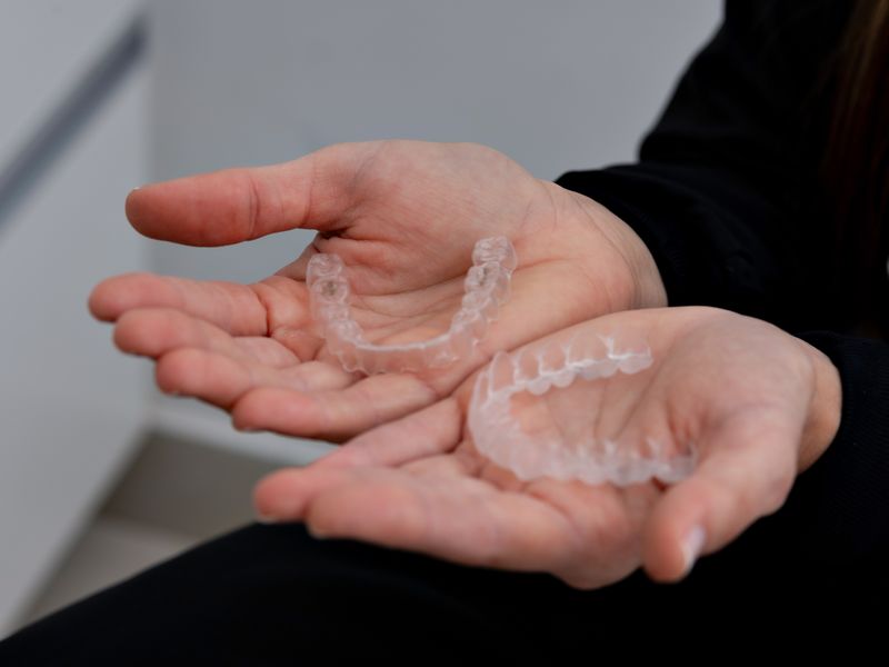 SureSmile clear aligner trays for digital orthodontic treatment at Englewood Dentistry