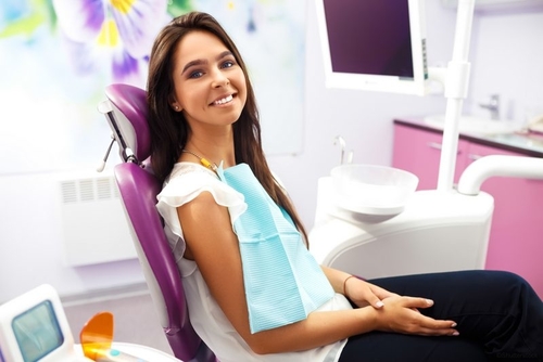 Woman in Dental Chair for Dental Cleaning